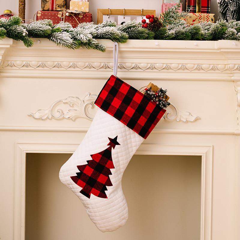 

Stylish White Christmas Socks With Festive Red And Black Grid Patterns Perfect For Holiday Decor White Tree