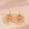 Europa und Amerika Metall Spiral Haken Ohrringe für Damen Persönlichkeit Kreisförmige Hohl Ohrringe Gothic Party Schmuck Geschenke