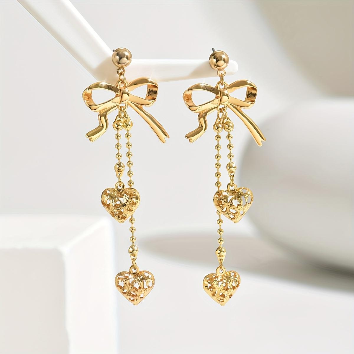 

1 пара элегантных модных серег с бантиком и полым металлическим кулоном в виде сердца, металлической шариковой цепочкой и кисточкой, классические женские серьги золотой