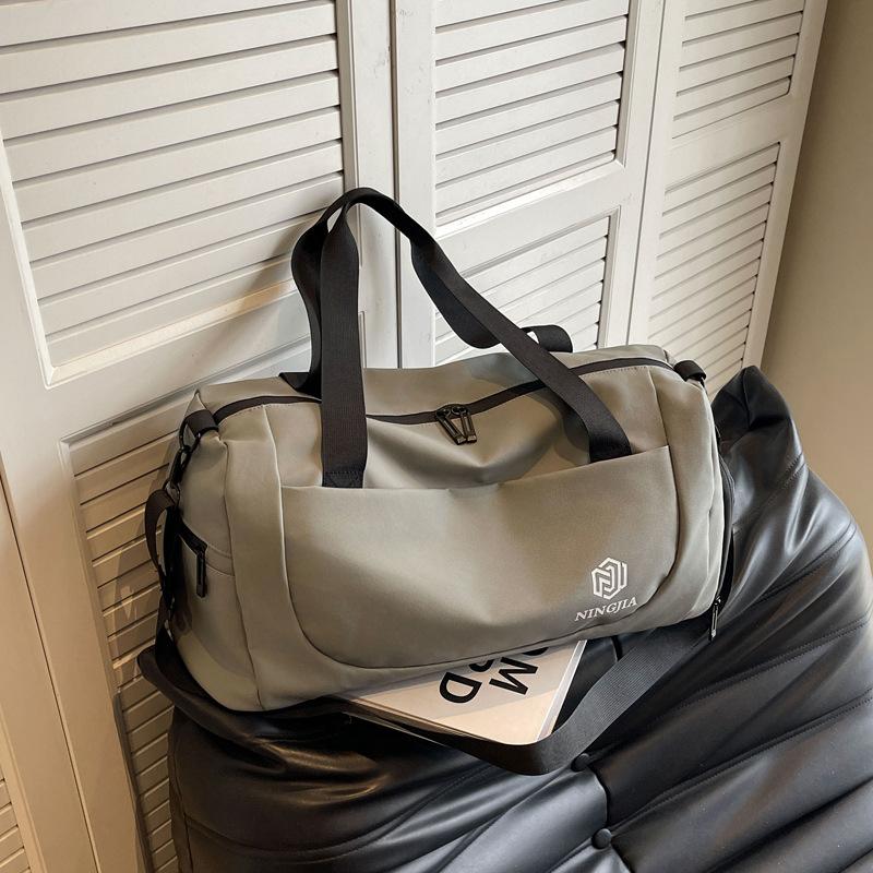 

Travel bag Large capacity men s fitness sports bag Portable business trip luggage bag Dry and wet separation yoga handbag світло-сірого кольору