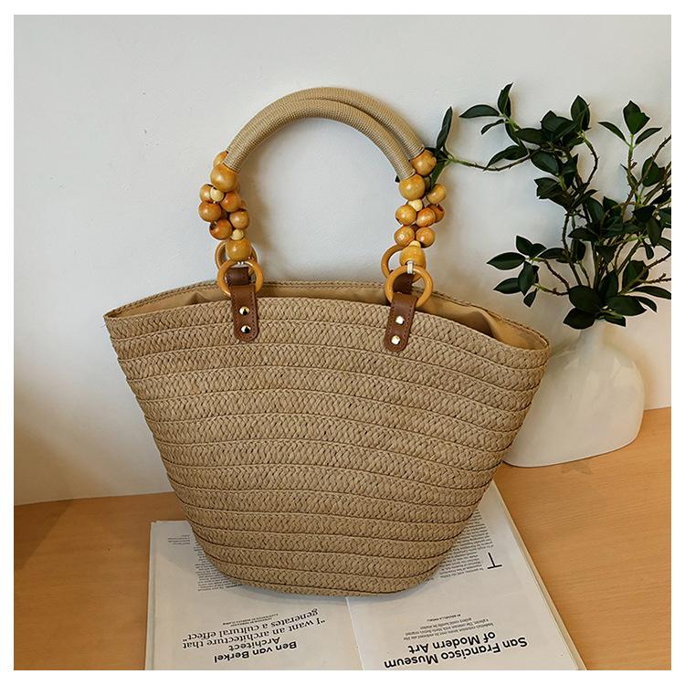 Design sense woven large-capacity handbag women's beach vacation style versatile solid color casual personality shoulder bag