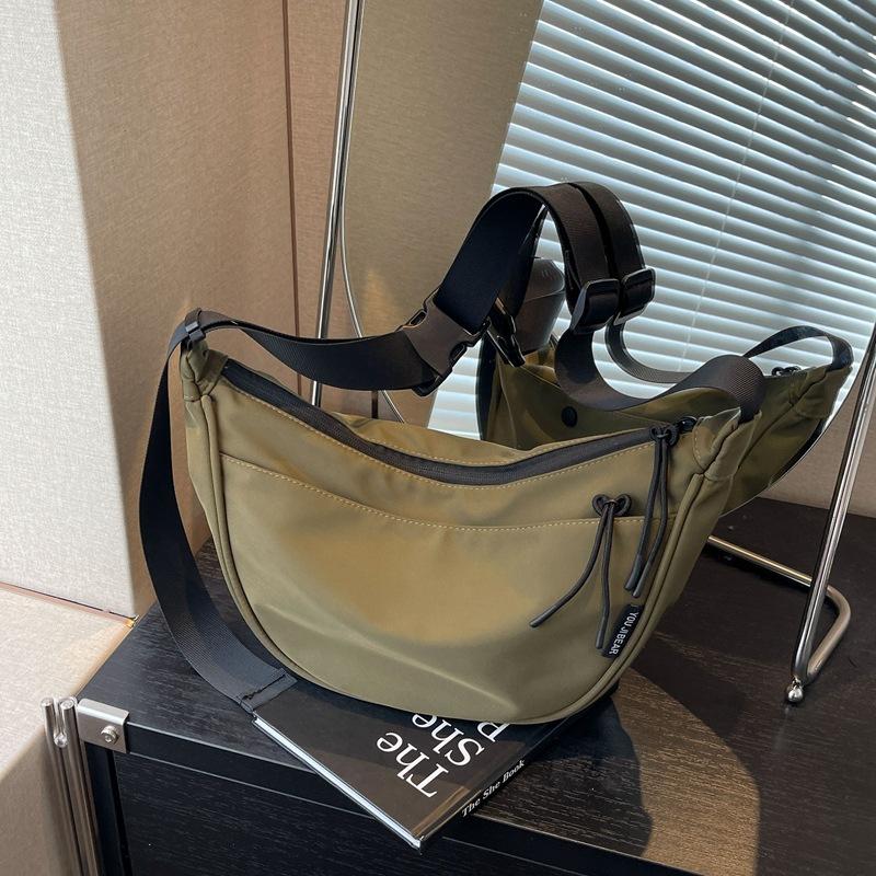 

Dumpling bag female messenger bag 2024 new large-capacity leisure college student class loading book sports shoulder canvas bag зелений