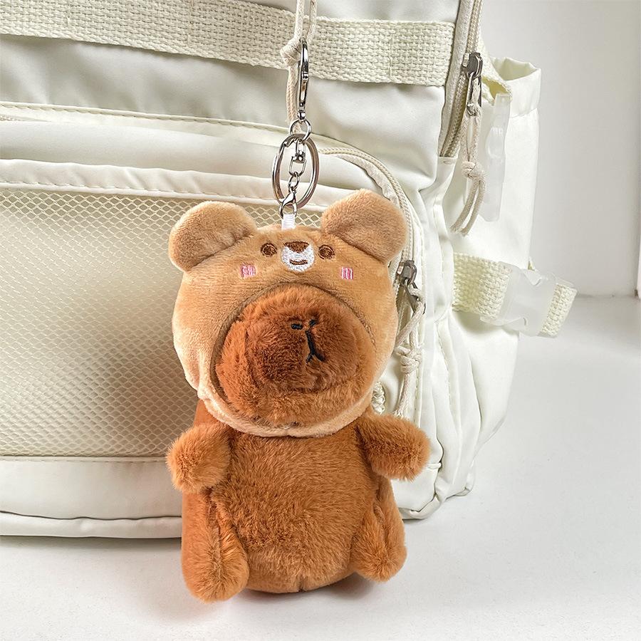

Capybara Lovable Plush Toy With Bear Hood Ideal For Decorations And Travel Gifts