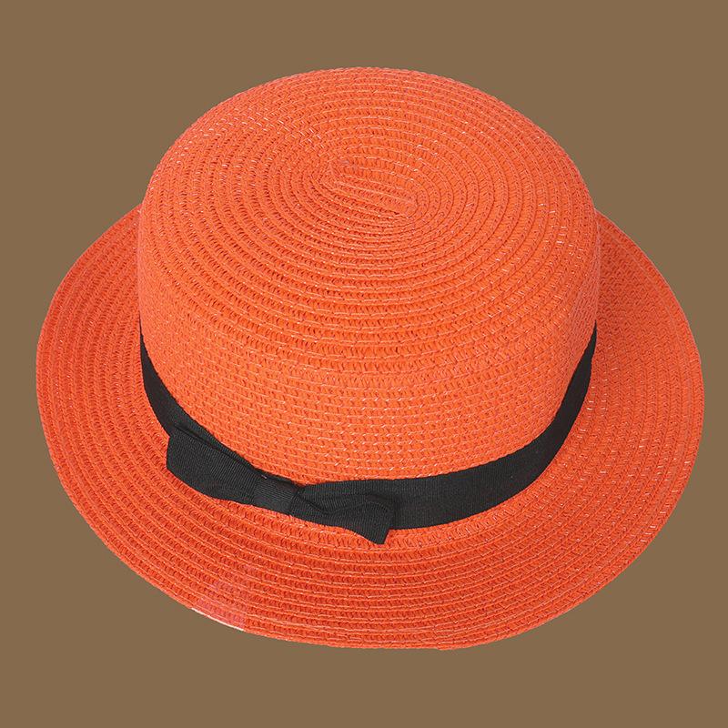 Frühling und Sommer Neuer Strohgestrickter Schleifen-Strohhut Koreanische Mode und Freizeit Faltbarer Strand Flache Oberseite Kurze Krempe Strohhut orange