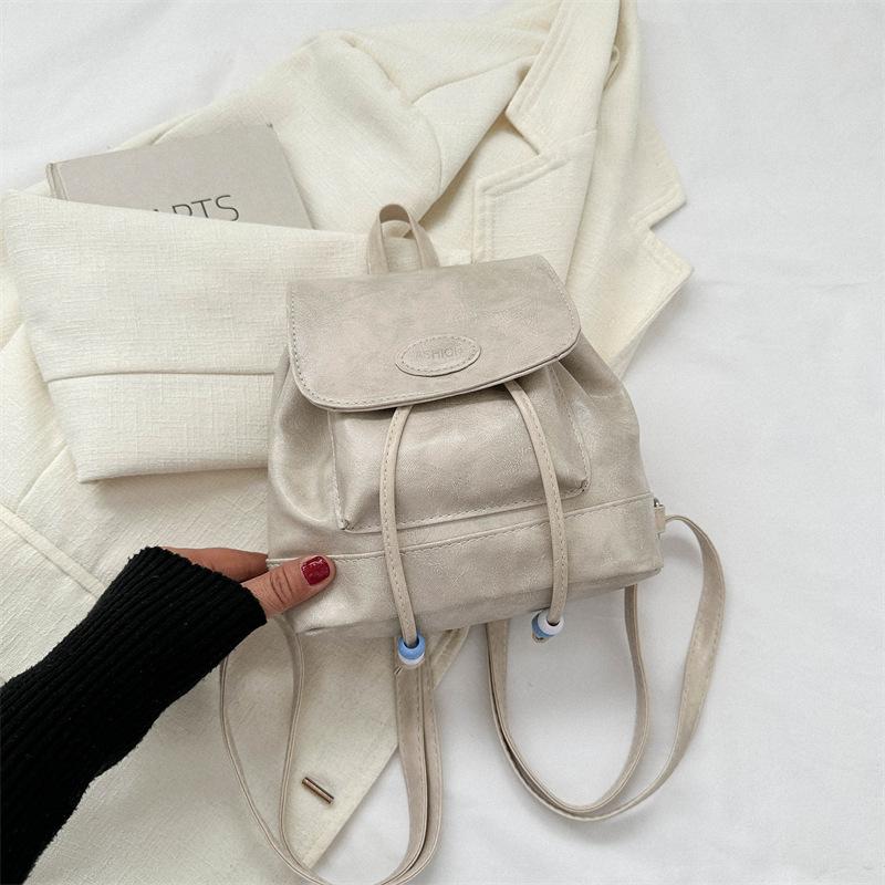 

Стильна та проста сумочка 2024 рання осінь нова іноземний стиль дівчина плечовий маленький рюкзак ретро вставка рюкзак бежевий