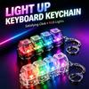 Original LED Leuchtender Schlüsselanhänger Tastatur Klickbarer Knopf Fidget Spielzeug zur Stress- und Angstbewältigung Tragbare Schreibtischdekoration Geschenke