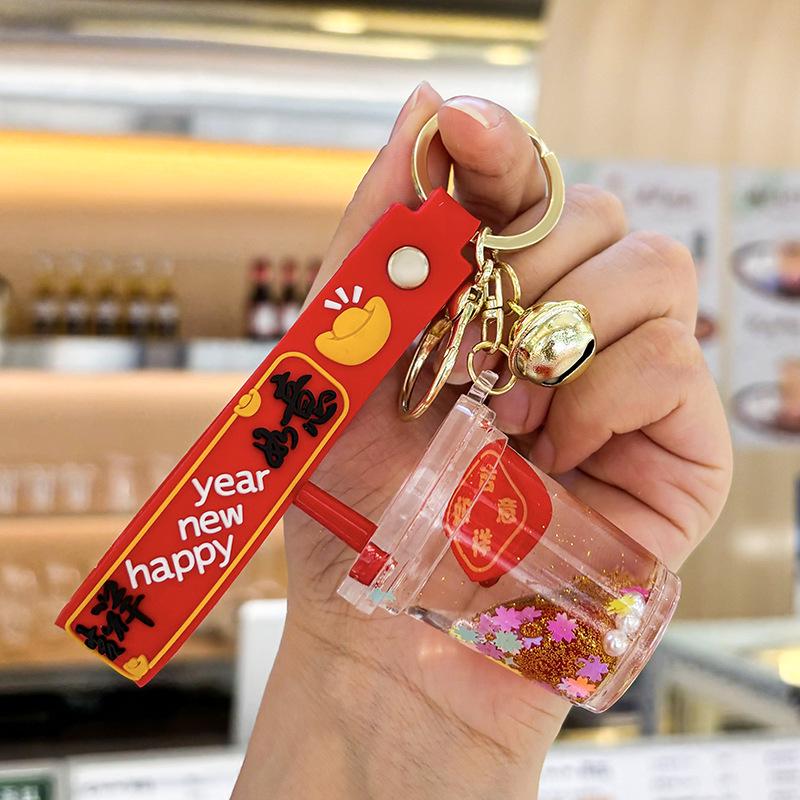 Akrylový přívěsek na klíče s tekutým pískem a obsahem oleje - Perfektní malý dárek na tašku nebo do auta.