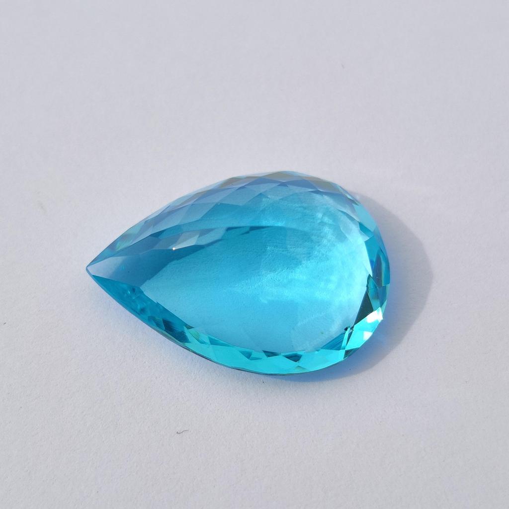 Pear Cut Sky Blue Topaz Shade Glass Stone, 21.95 Carat, 24x18x10 MM Size Pear Shape Stone.