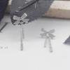 Bow Tassel Stud Earrings Female Tide Korean Temperament Niche Design Sense High-end Light Luxury Earrings