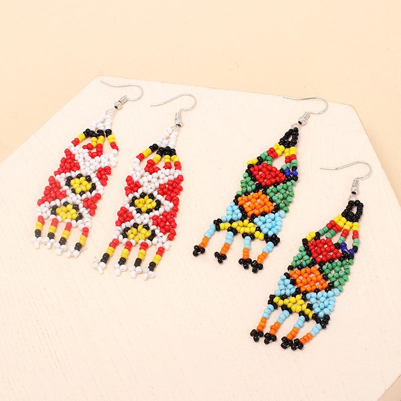 European and American ethnic style handmade rice bead fringed earrings, niche design sense vintage retro earrings
