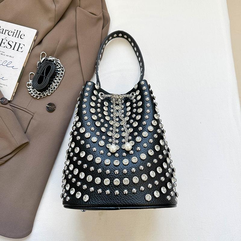 

European and American fashion portable women s bags 2025 autumn new casual bucket bags personalized trendy cool polka dot rivet armpit bags
