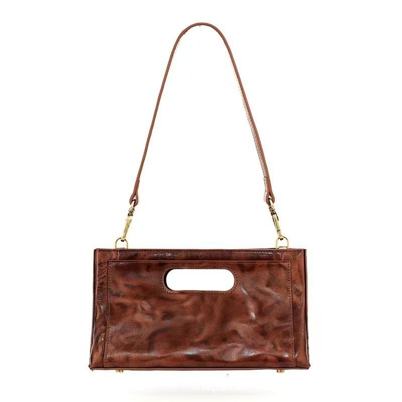 Cowhide tote bag women's new niche design chain underarm bag hand grab pleated pattern versatile shoulder bag