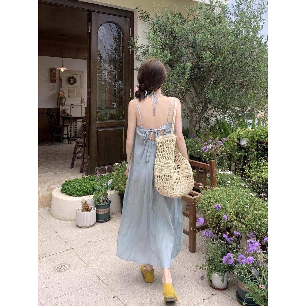 Seaside vacation style blue suspender dress women's spring new loose backless strap A-word long dress ins trend