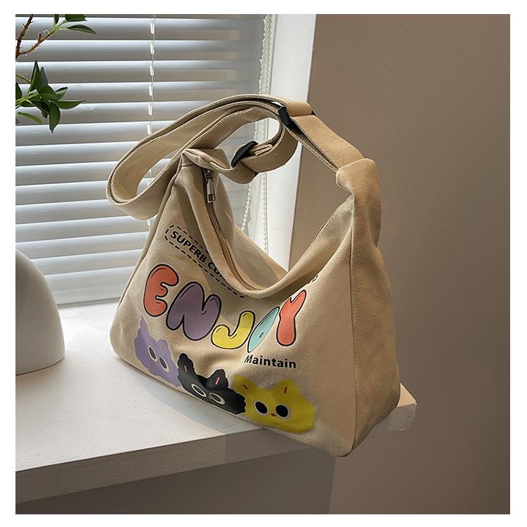 Canvas Bag Women's Large-capacity Bag New Fashion Cartoon Letter Casual Shoulder Messenger Bag
