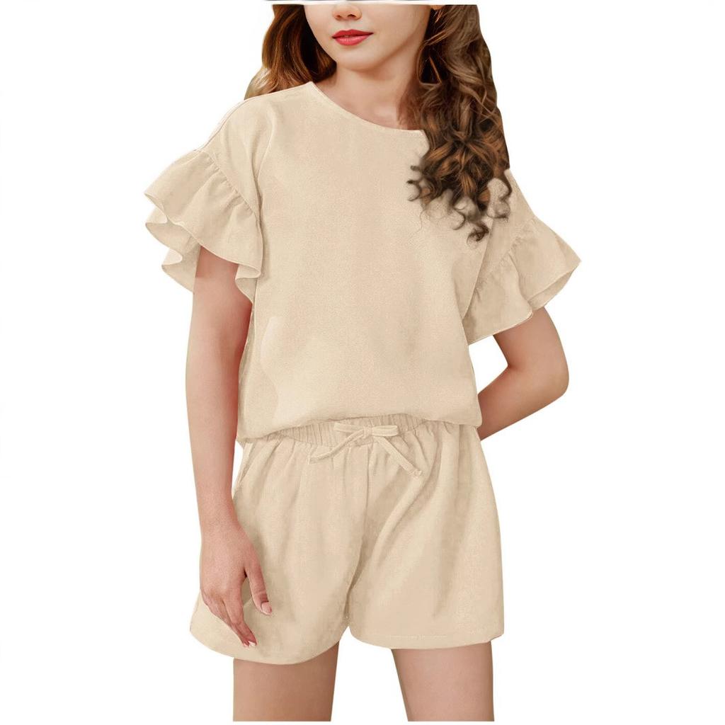 A Two-piece Set Of A Light, Solid-color Casual Sports Top With Ruffled Short-sleeved Round Neck And Shorts For Medium And Young Children In Summer