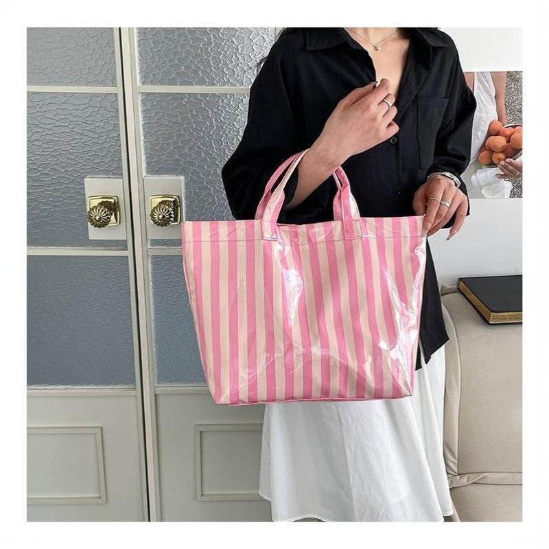 This Water-Resistant Pvc Tote Bag Features A Pink And Blue Striped Design, A Large Capacity, And Is Suitable For Beach Shopping,