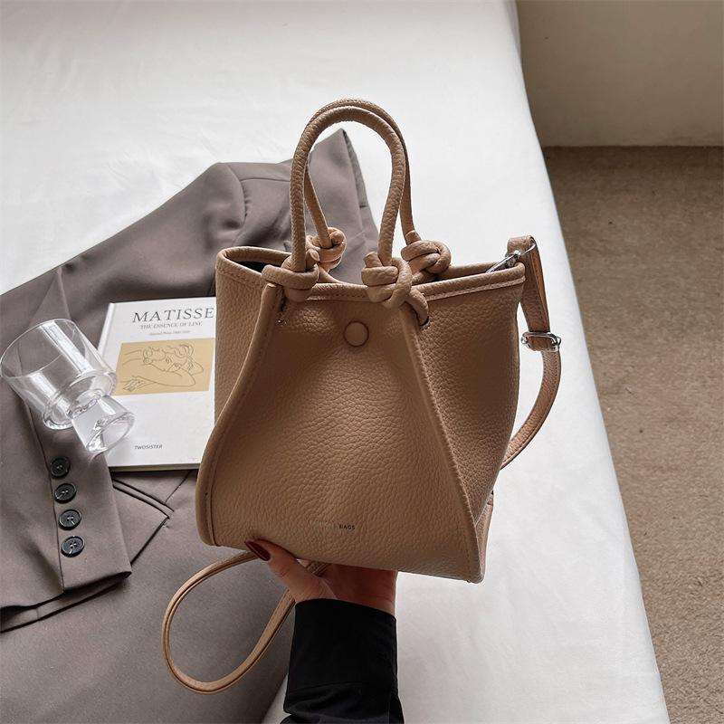 Korean Version of Niche Portable Commuter Bag Women's 2025 New Simple Bucket Bag Versatile Shoulder Cross Wing Bag