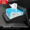 Toyota BZ3 Dashboard Organizer: Center Console, Screen, Rear Storage, and Tissue Holder.