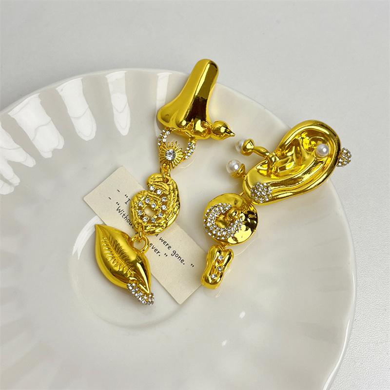 Brincos de folha estilo corte retrô europeu e americano, design de nicho, olho de demônio, temperamento leve e luxuoso, brincos longos