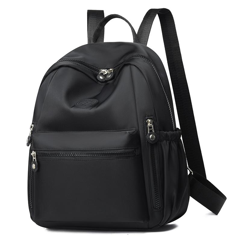 

Минималистичный шикарный рюкзак однотонный школьный рюкзак круглый логотип и многокарманная организация Оксфорд регулируемый комфорт для ежедневного использования чёрный