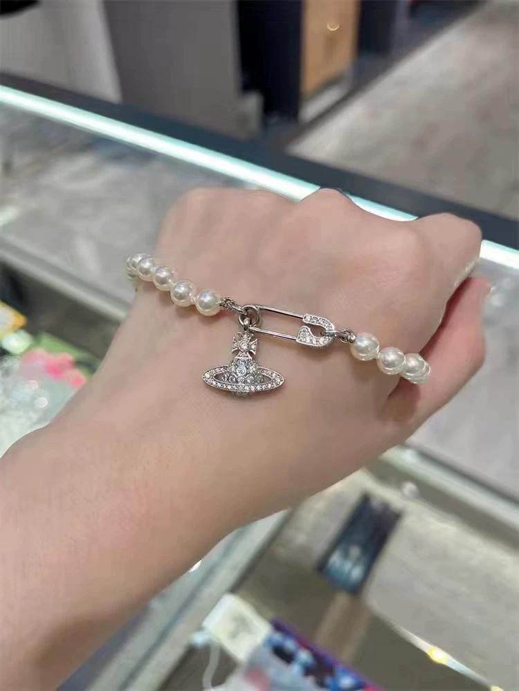 

Брошь-подвеска «Императрица Доуэгер» - Классический чокер и цепочка «Сатурн» до ключиц, стиль «легкая роскошь»