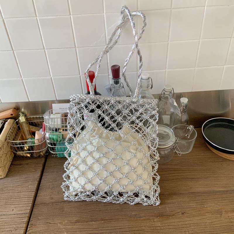 

Niche fashion woven hollow mesh bag women s new seaside vacation beach bag shoulder bag серебряный