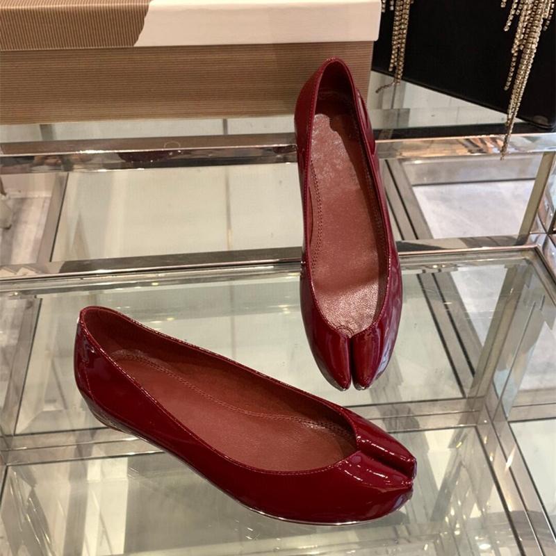 Fashion In 2025, A Woman With A Single Shoe, Wearing A Small Red Ballet Shoe And A Patent Leather Shoe With A Pig'S Foot Toe Separation
