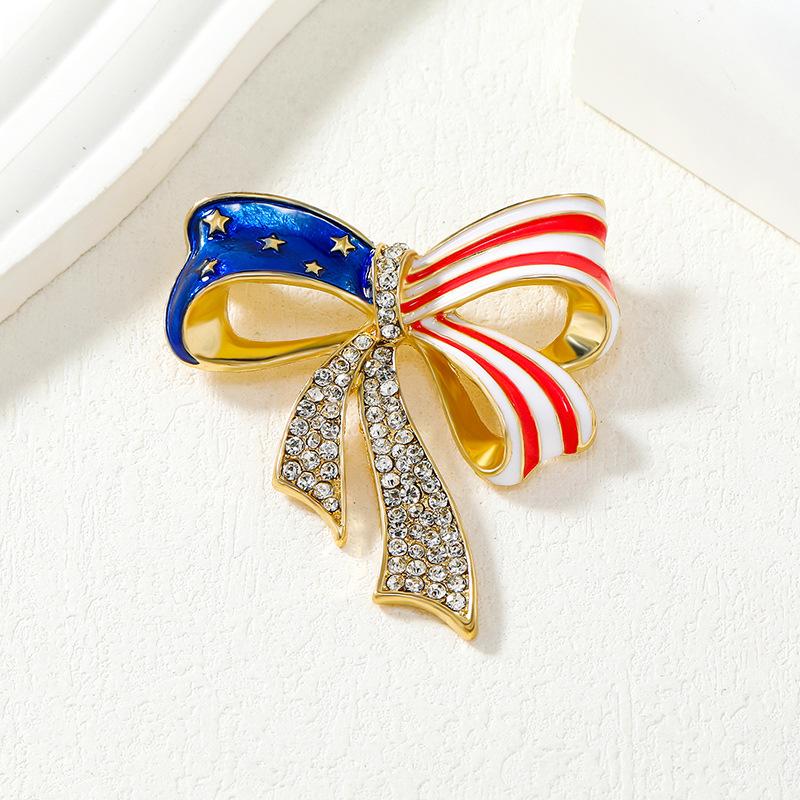 Brož ve tvaru mašle s americkou vlajkou, niche high-end univerzální, brož osázená diamanty, evropská a americká, personalizovaná, s kapkami oleje