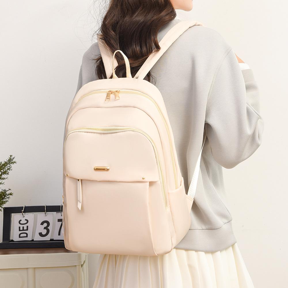 Women's new commuter backpack simple niche versatile student bag going out cover tie rod portable travel backpack