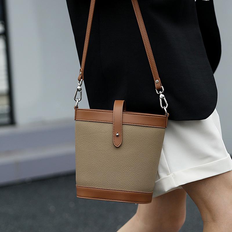 New fashion shoulder messenger bag first layer cowhide women's bag genuine leather contrasting color commuter bucket bag contrasting color design