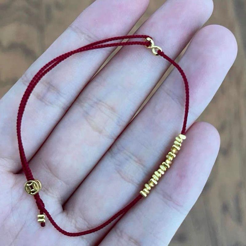 

2023 Новое поступление Оригинальный дизайн Маленькие веера для денег Очень тонкий ремешок для переноски Мини Золотой плетеный вручную браслет Регулируемый Red