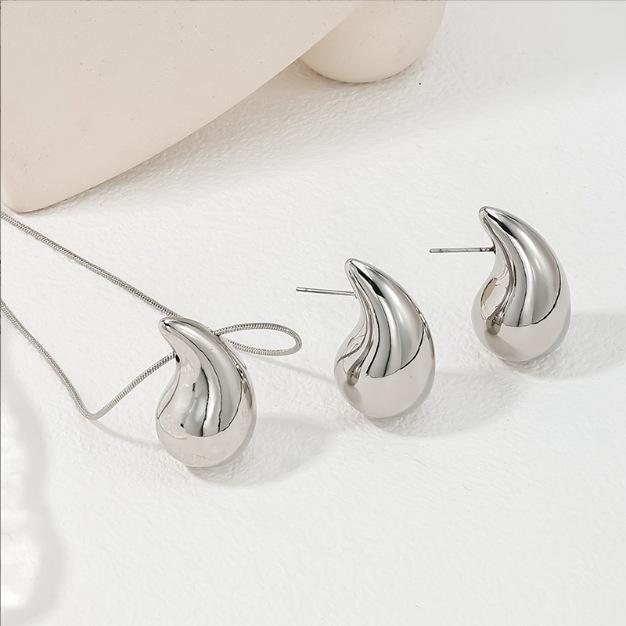 Schmuck aus dem Nahen Osten Wassertropfen-Typ Glänzendes Komma-Anhänger-Halskette Ohrstecker Personalisiertes Einfaches Wind Schlüsselbeinketten-Set Schmuck Damen