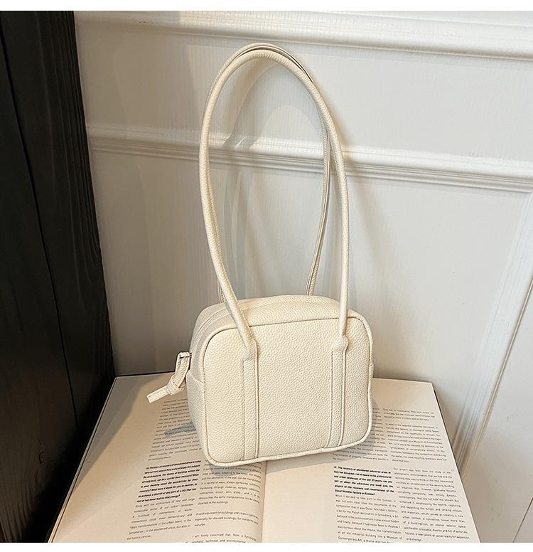 Retro niche portable bowling bag 2025 spring and summer new solid color shoulder bag temperament simple handbag