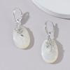 Exquisite Mother-of-Pearl Sterling Silver Luxury Earrings with Unique Face-Inspired Design