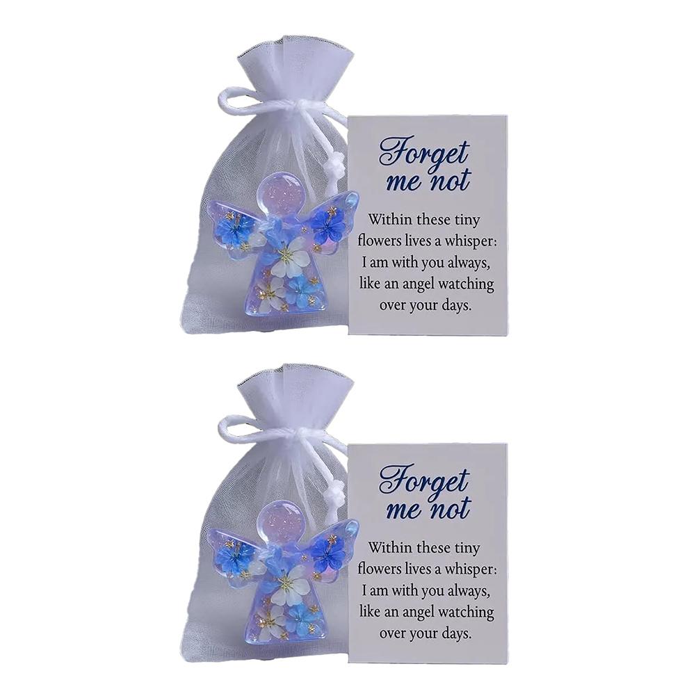Sympathy Forget Me Not Angel present with intricate flower accents created to offer peace and remembrance in times of sorrow