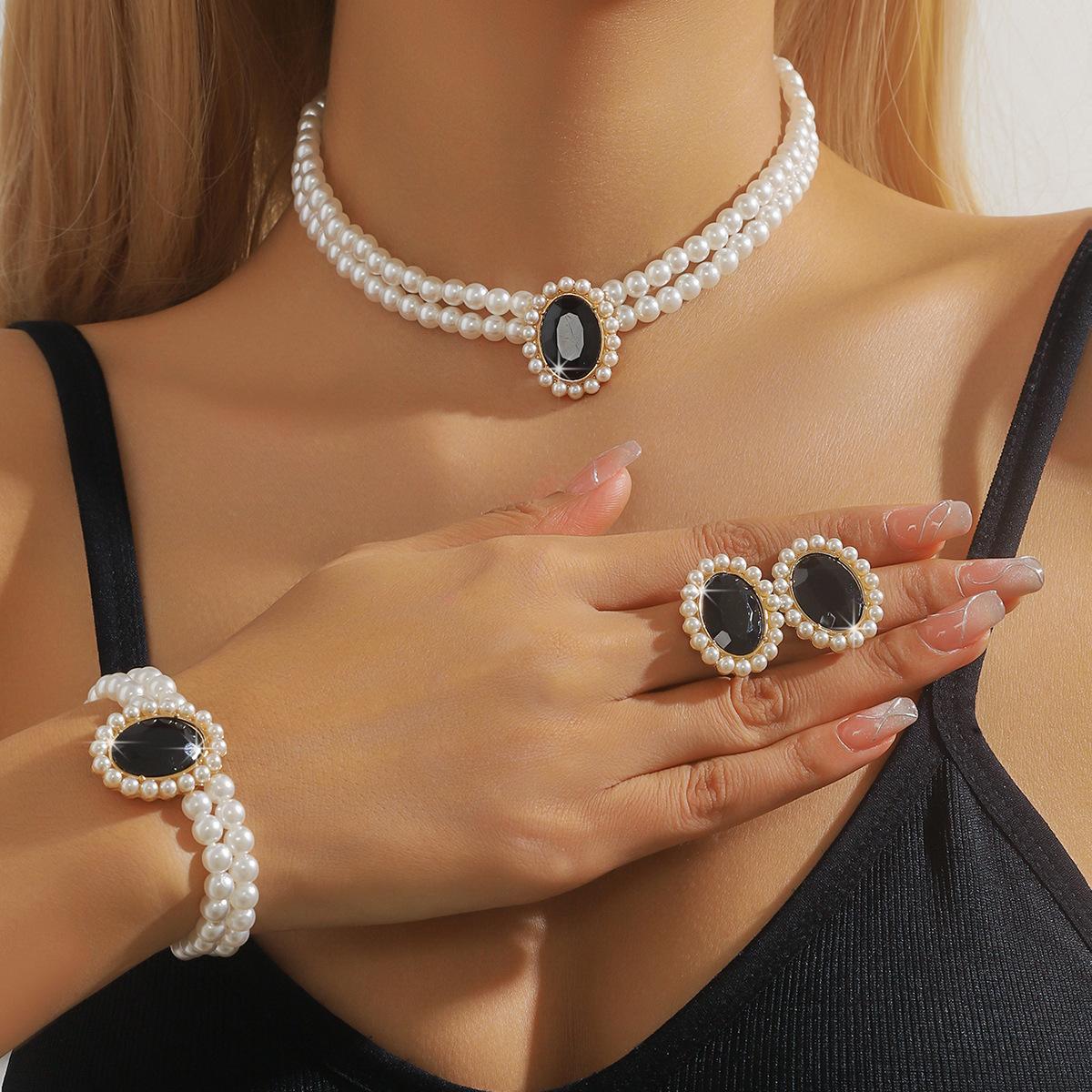 

Fashion And Luxury Double-Layer Imitation Pearl Oval Crystal Necklace, Stud Earrings, Bracelet, Three-Piece Set.
