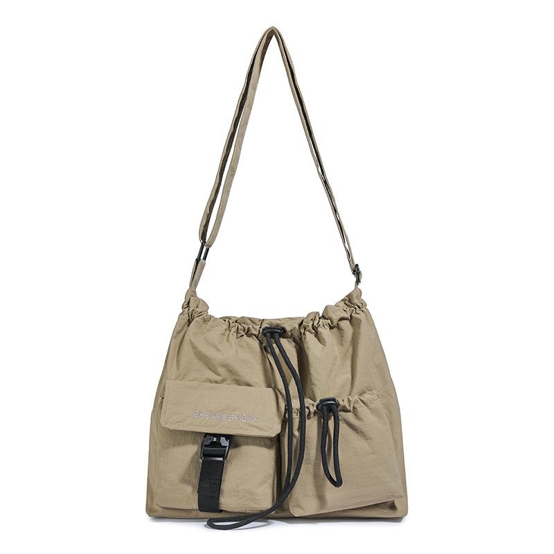 

New Korean version women s college students simple drawstring messenger bag niche retro lightweight square bag travel shoulder bag women хакі
