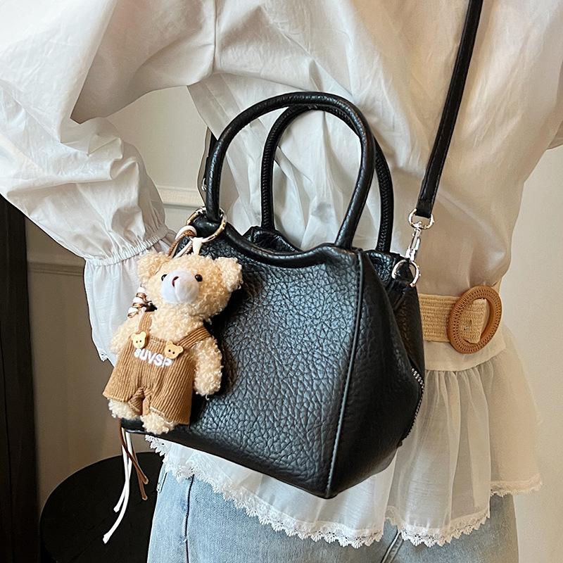 Wholesale fashion high sense simple style solid color lychee pattern bucket bag casual versatile commuter messenger women's bag