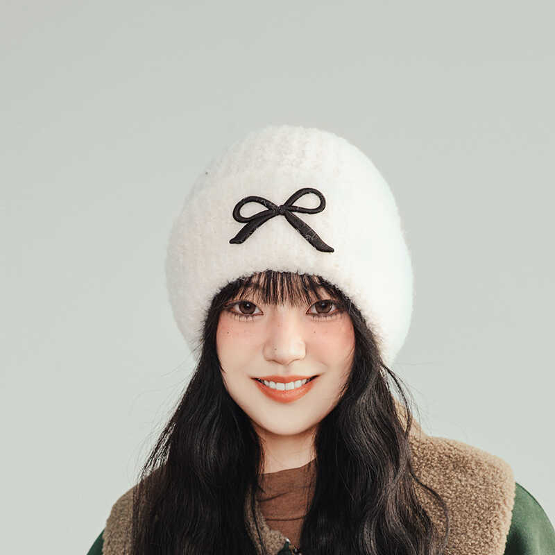 Hat women's autumn and winter wool hat new cute bow versatile cold hat ear protection warm knitted hat tide