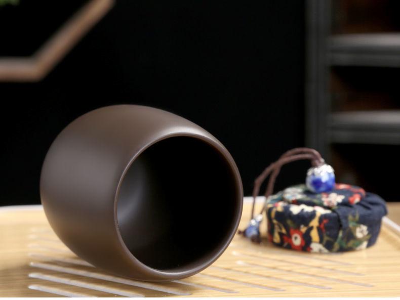 Zisha Travel Tea Set: Portable Xishi Pot with Quick-Brew Cup and Four Cups - Perfect for Outdoor or Home Tea Ceremonies.