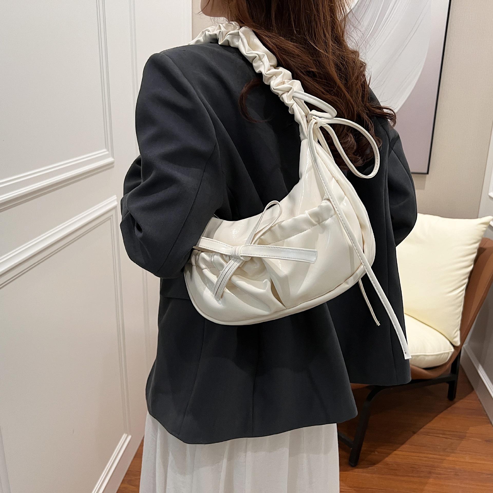 

Drawstring pleated PU leather women s bag new niche design underarm bag high-end texture casual shoulder messenger bag