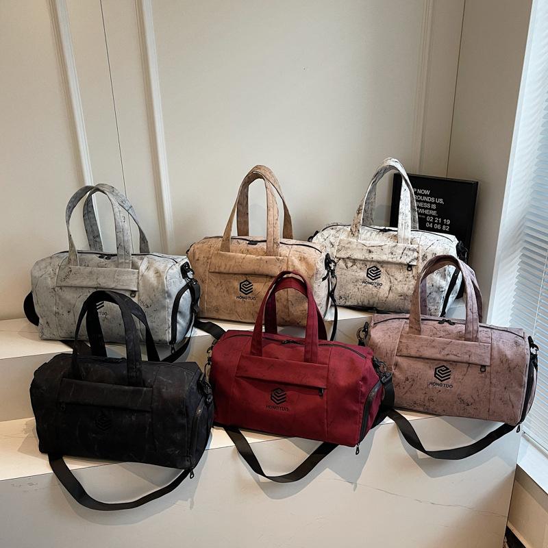 Travel bag Women's fashion handbag Short-haul large-capacity luggage Women's lightweight sports cover Tie rod Going out fitness bag