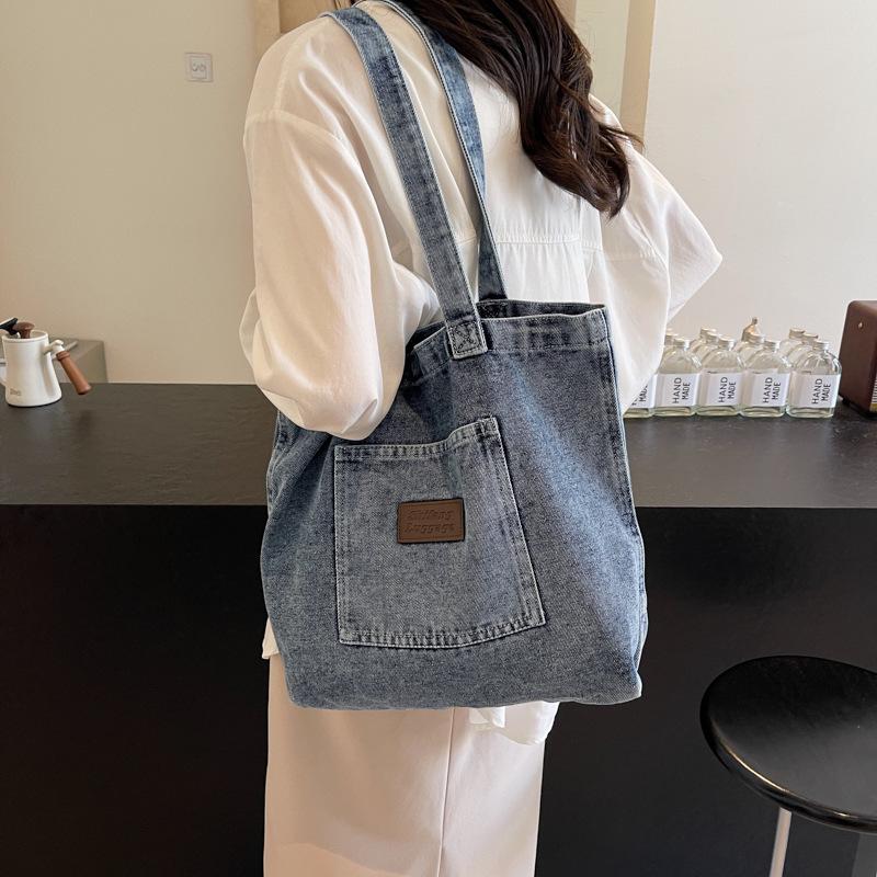 Korean version of casual washed denim bag women's 2025 new fashion canvas pocket literary shoulder bag tote bag