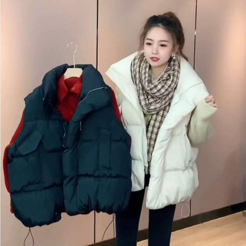 Dámská vesta z prachového peří