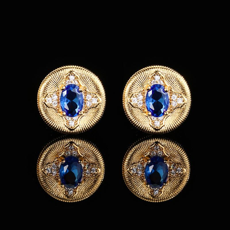 

Осенне-зимние украшения Медное основание Золотое покрытие Имитация красного корунда Синяя шпинель Ретро Круглый камень 5 * 7