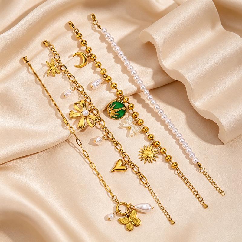 Women's European Retro Multi-Element Titanium Steel Bracelet with 18K Gold Plating and Pearl Accents