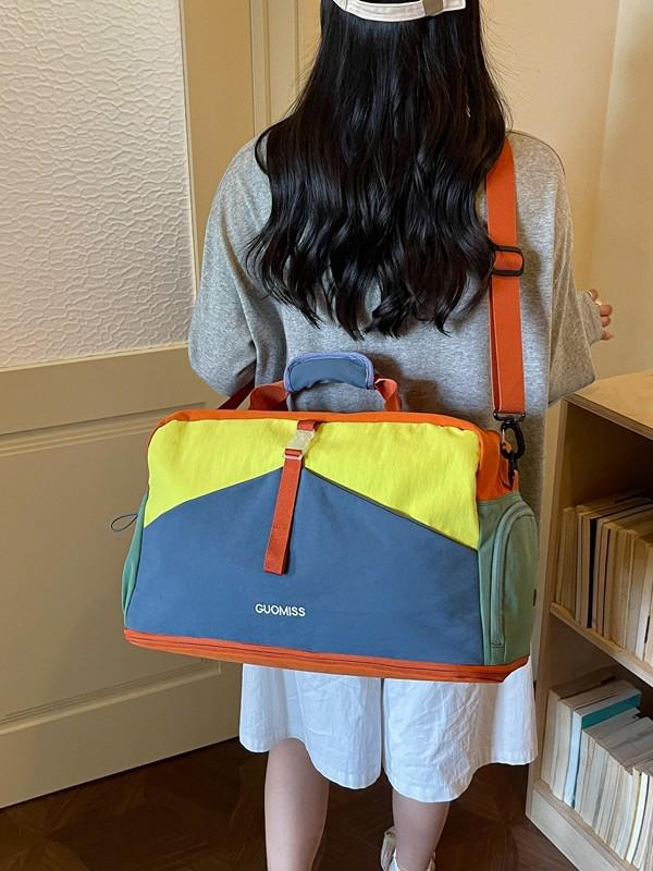 Trendy Color Block Fitness Travel Bag with Wet/Dry Separation, Large Capacity, and Handheld Design.