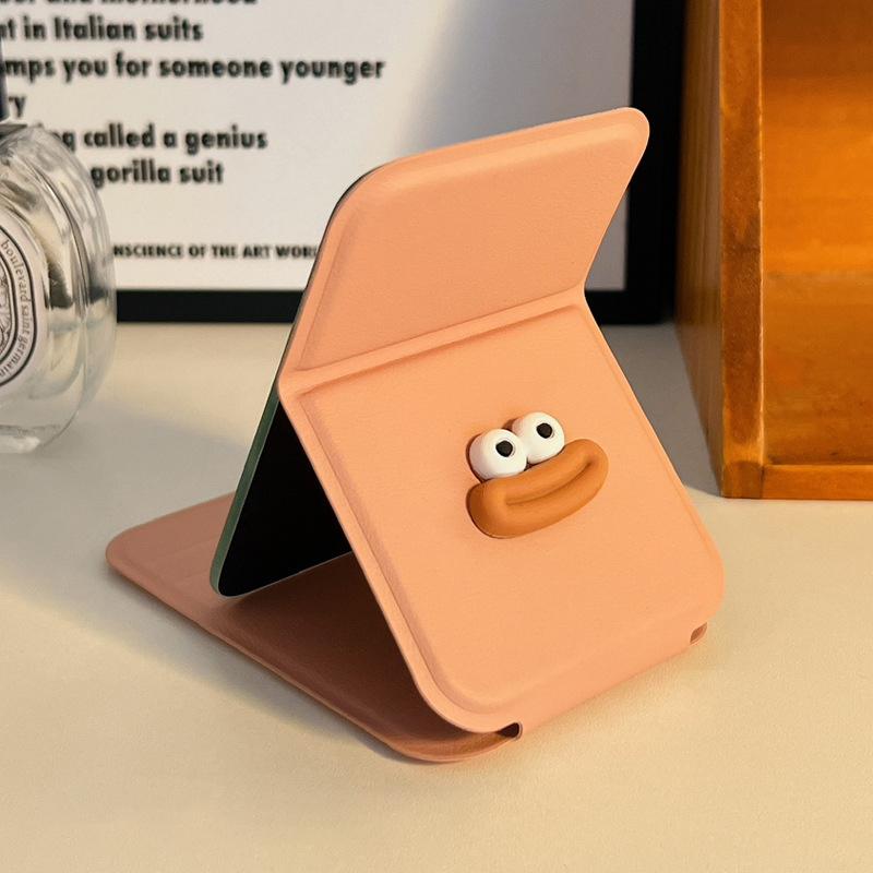 

Мультяшное дорожное складное косметическое зеркало из высококачественной искусственной кожи, портативное карманное косметическое зеркало с одной стороной, креативное женское однотонное настольное зеркало с ручкой розовый