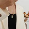 French Retro Clavicle Chain Necklace: 18k Gold-Plated Titanium Steel with Cat's Eye Oval Pendant for Women