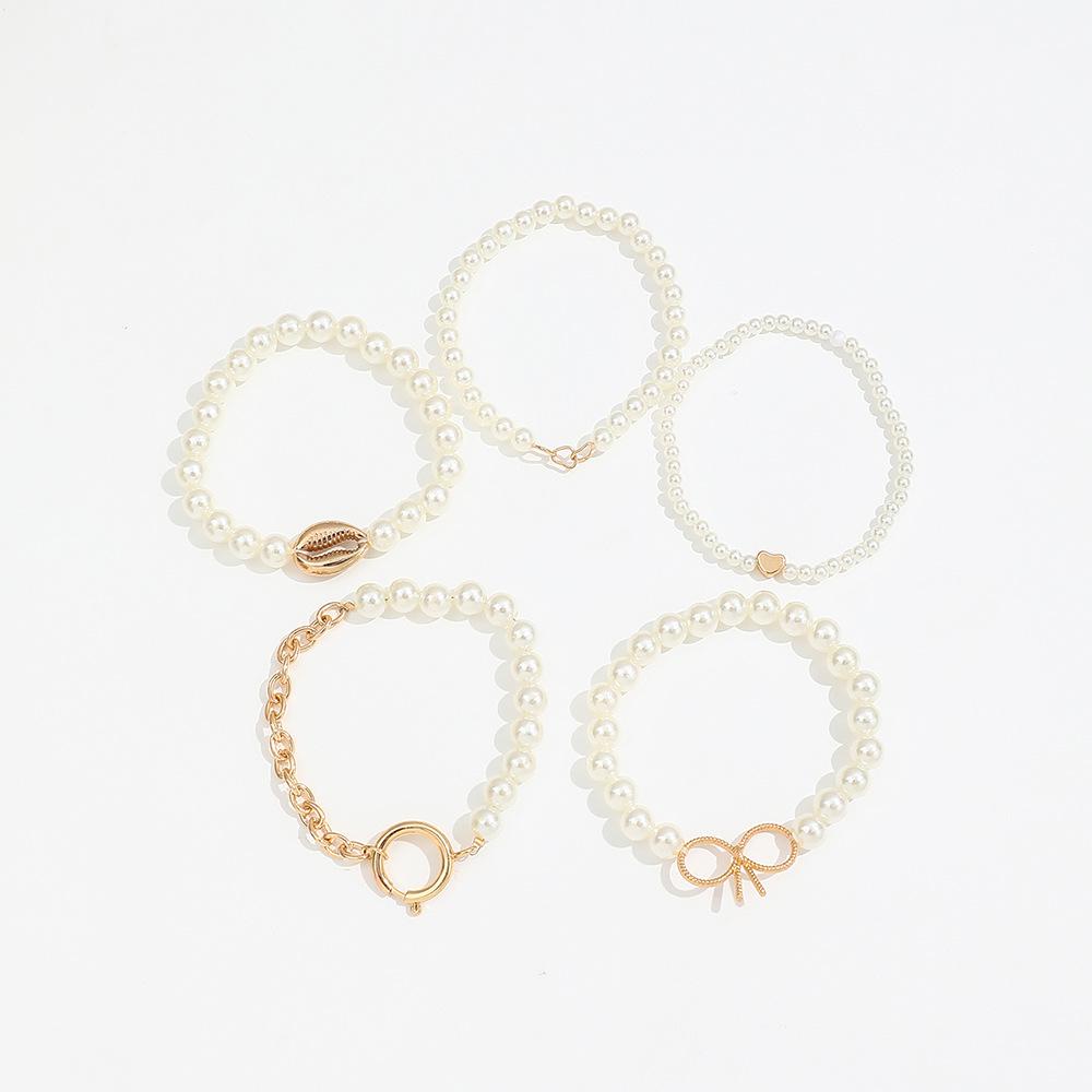 5-Piece Ocean-Inspired Faux Pearl Bracelet Set for Women with Bow, Heart, and Shell Accents